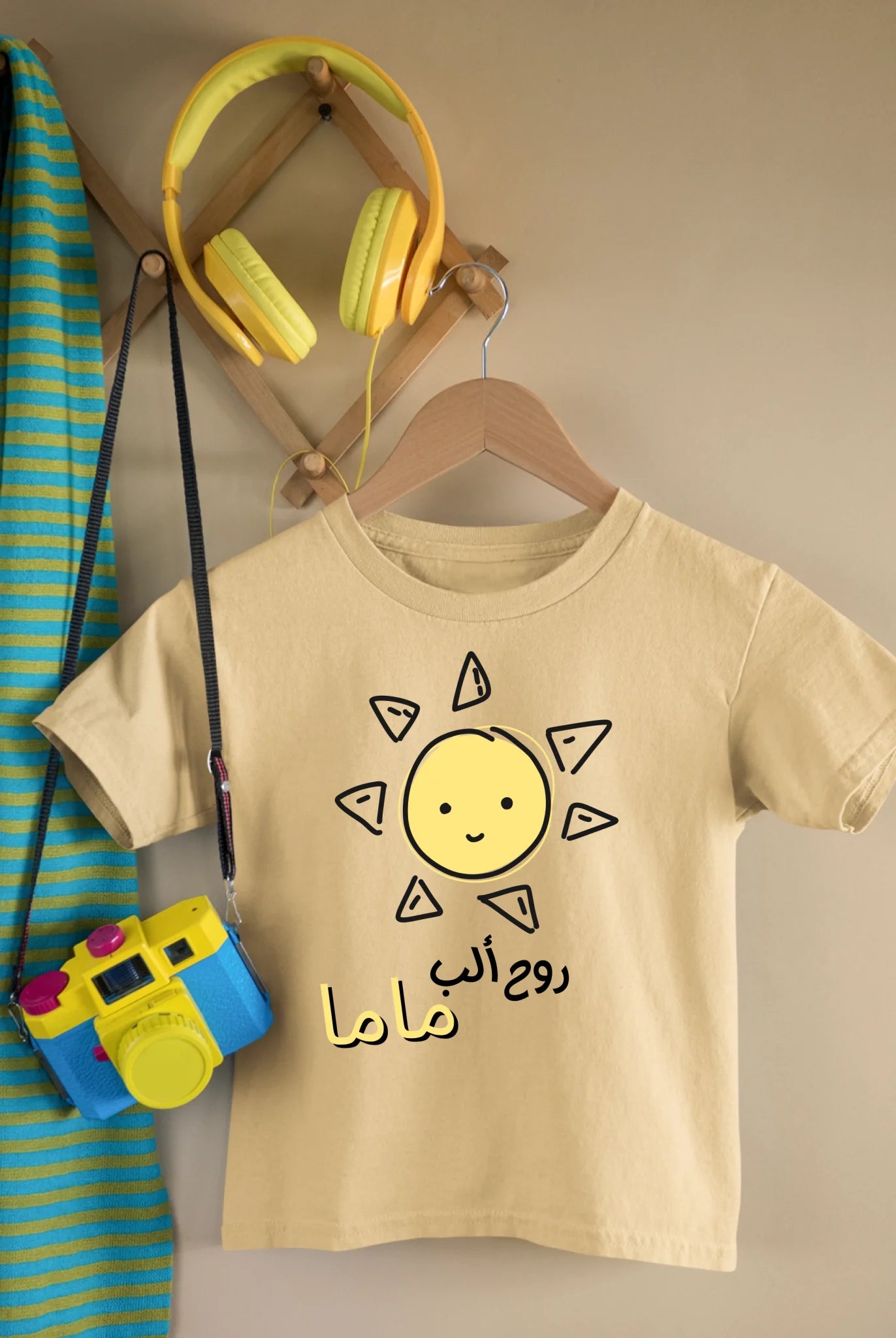 mockup-of-a-kid-s-t-shirt-featuring-a-toy-camera-and-headphones-33738