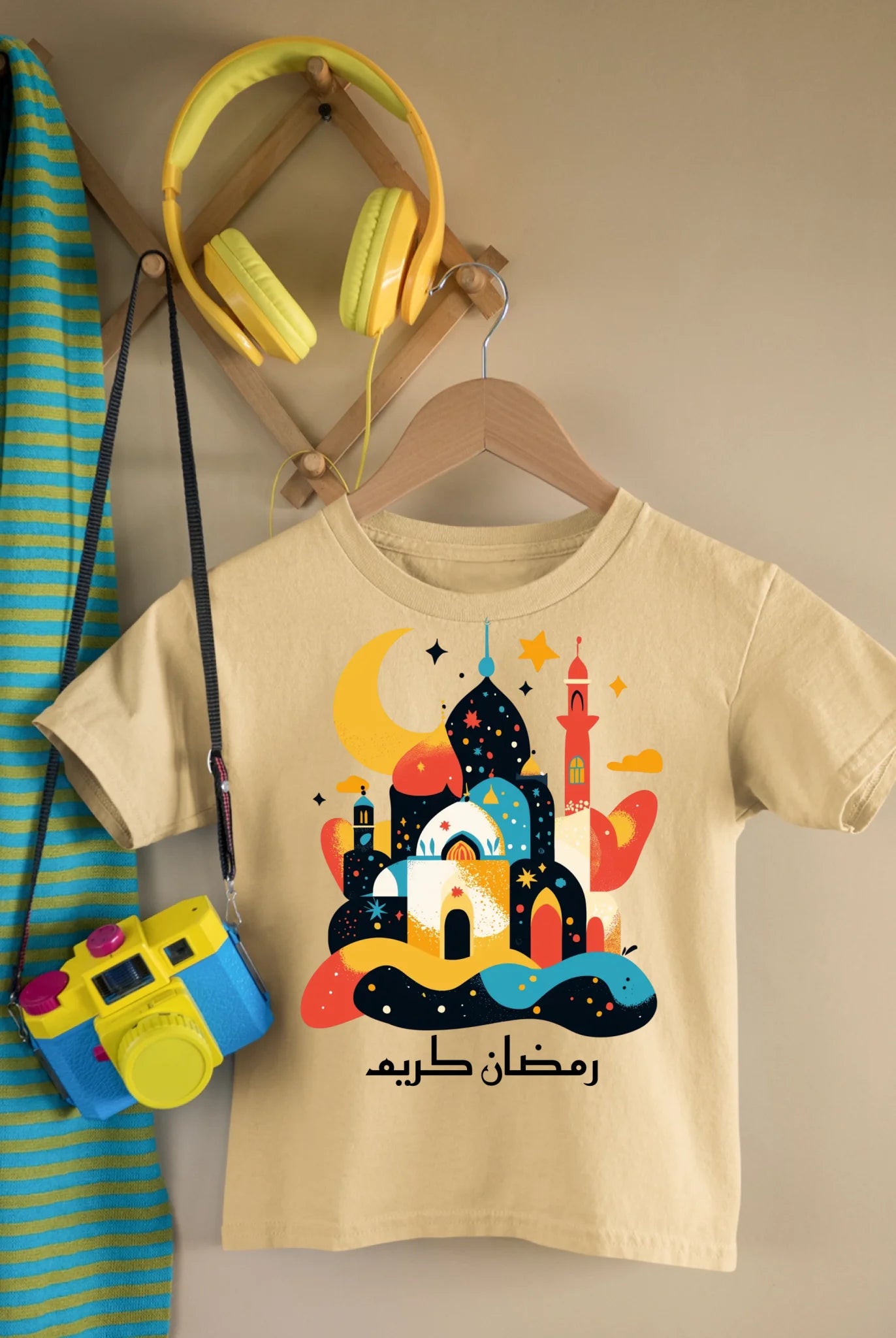 mockup-of-a-kid-s-t-shirt-featuring-a-toy-camera-and-headphones-33738