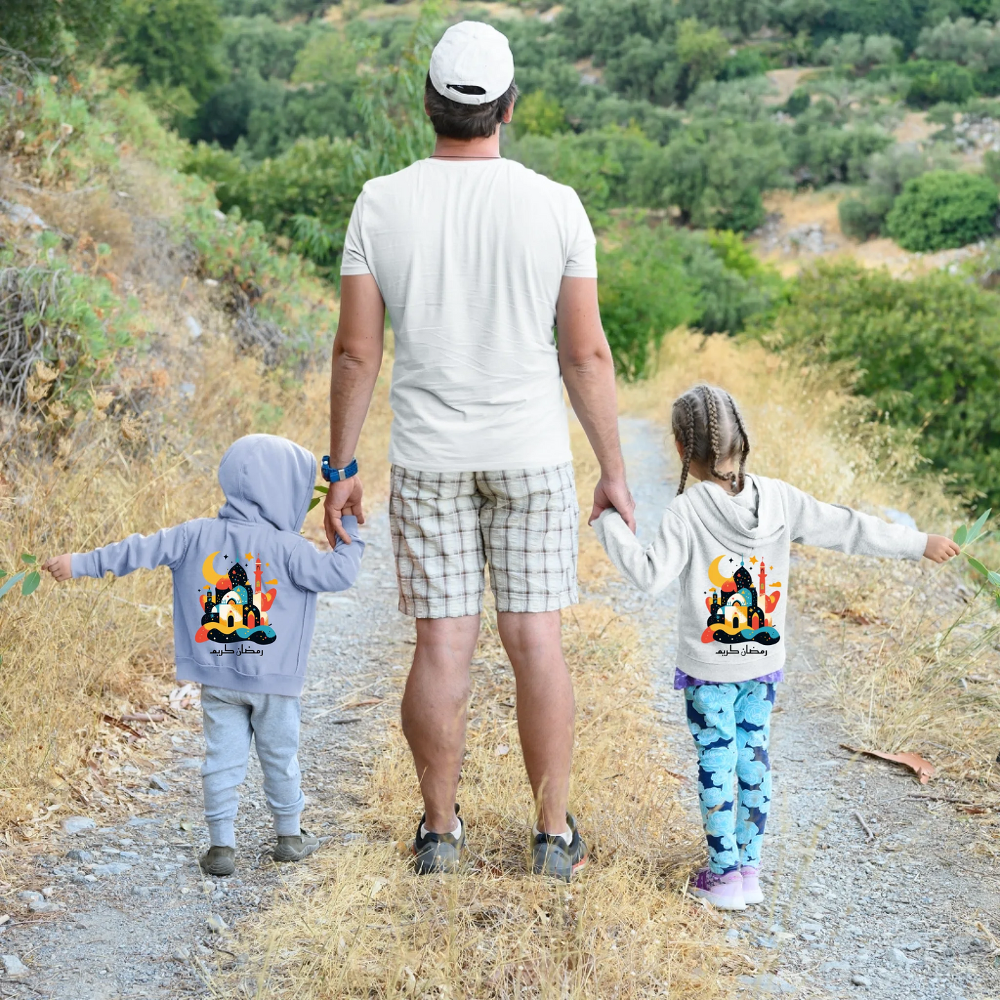back-view-of-a-t-shirt-and-a-hoodie-mockup-featuring-a-dad-with-his-children-hiking-m9045-r-el2
