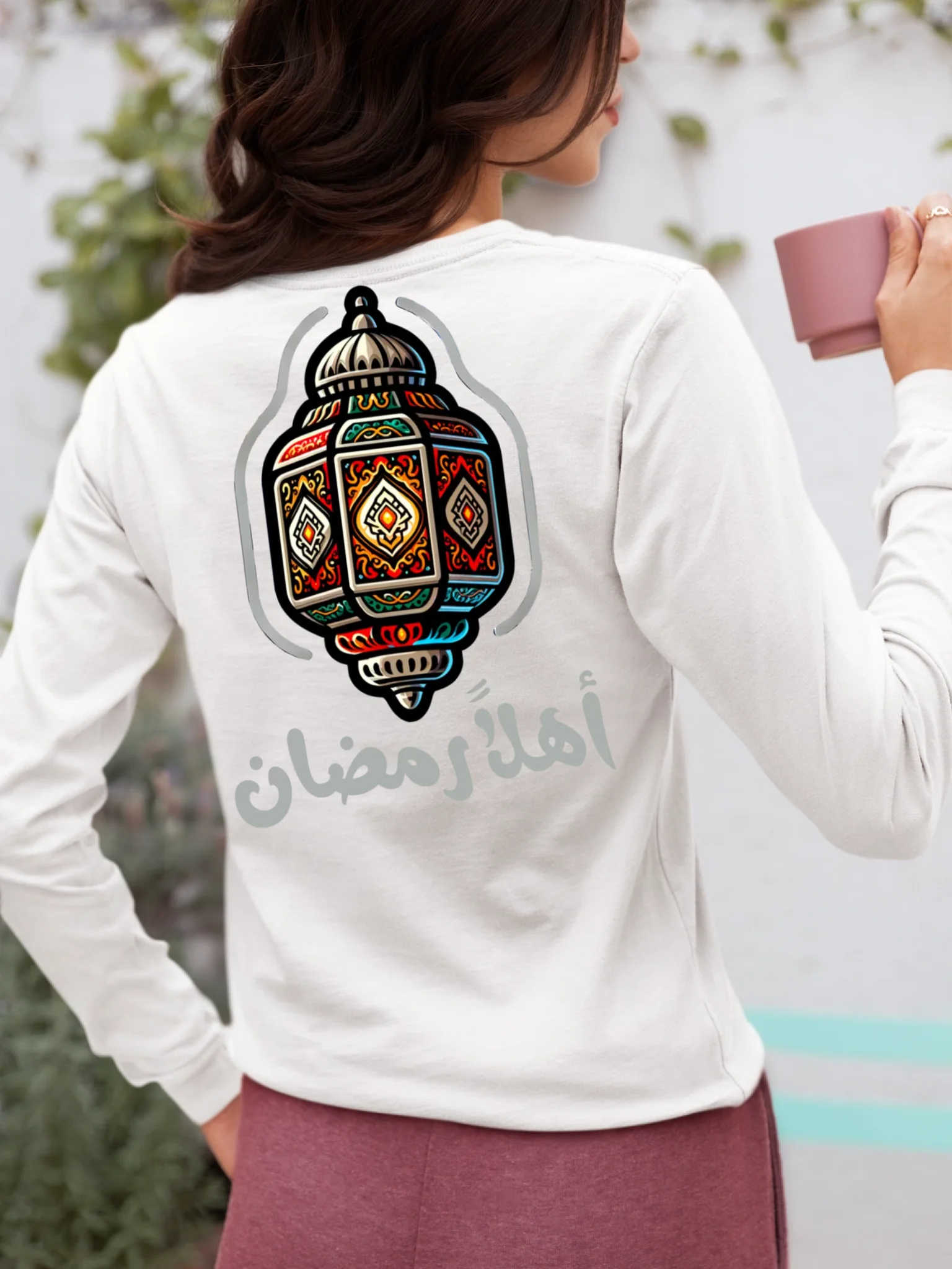 back-view-bella-canvas-long-sleeve-tee-mockup-of-a-woman-holding-a-mug-m37313