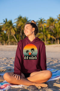 hoodie-mockup-of-a-smiling-girl-sitting-at-the-beach-26805