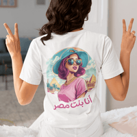 Person wearing a white t-shirt with a colorful graphic and text, making peace signs.