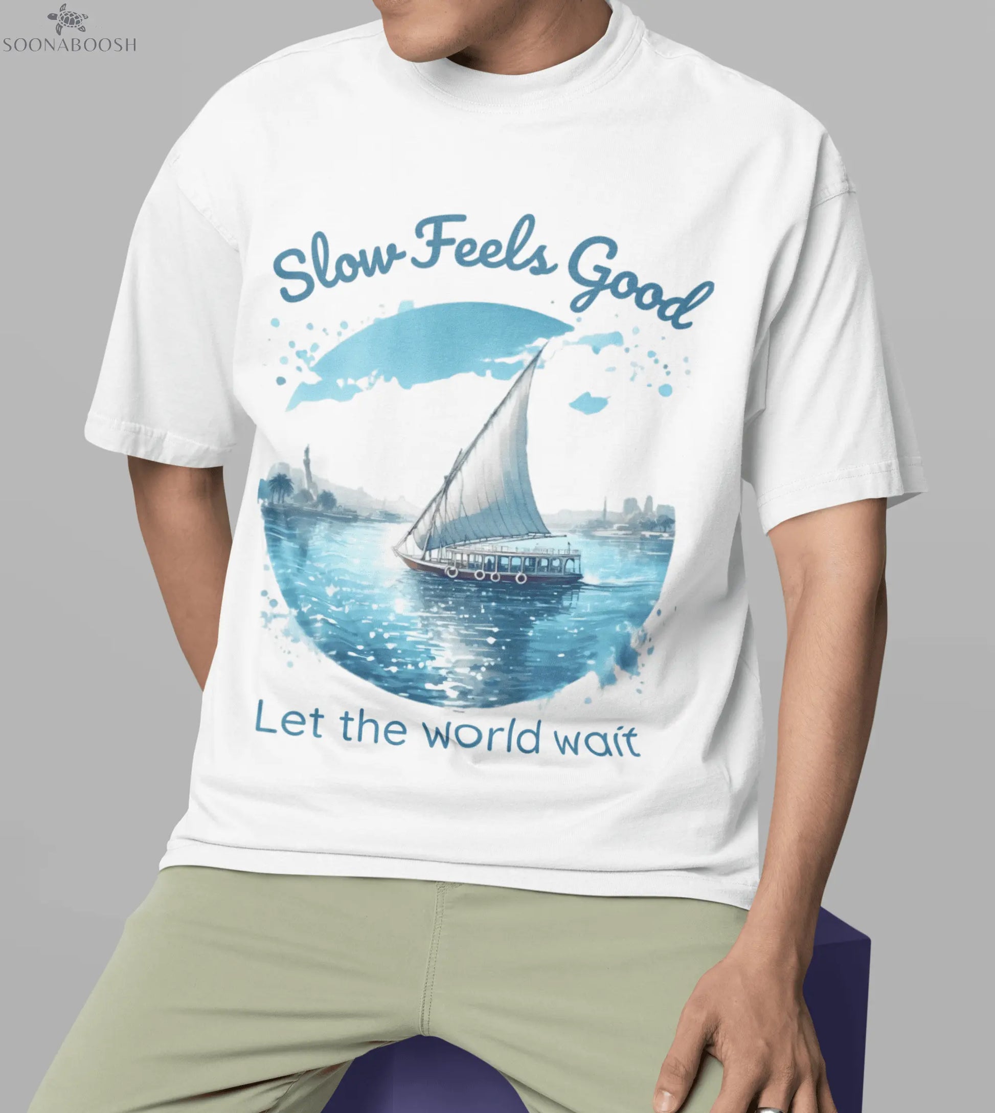 Graphic of Egyptian Nile and Sail Boat with the words Slow Feels Good above and Let the World Wait below.